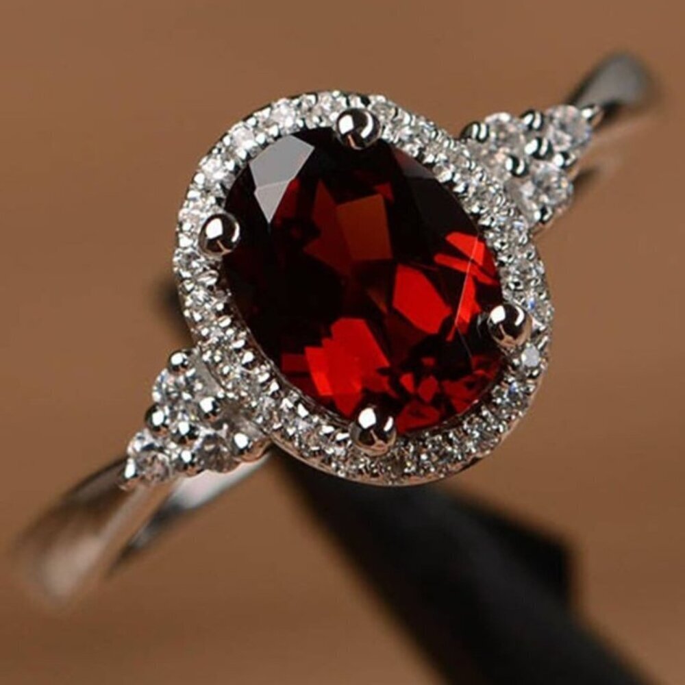 Oval Garnet and Moissanite Halo Ring in Sterling Silver